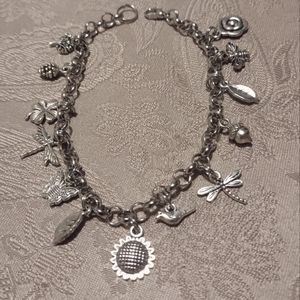 Silver circle link chain charm bracelet with various silver nature charms